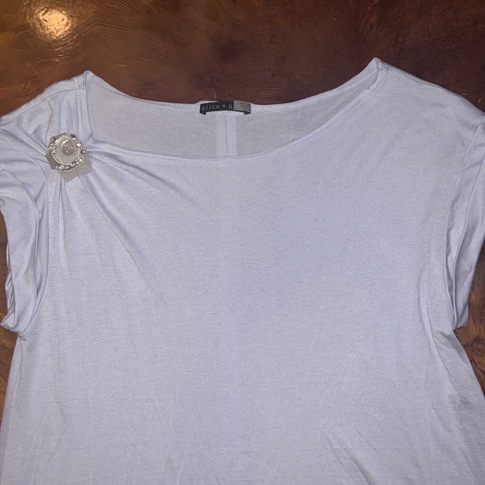 Brand new w/o tags, ALICE and OLIVIA blouse with diamond collar detail